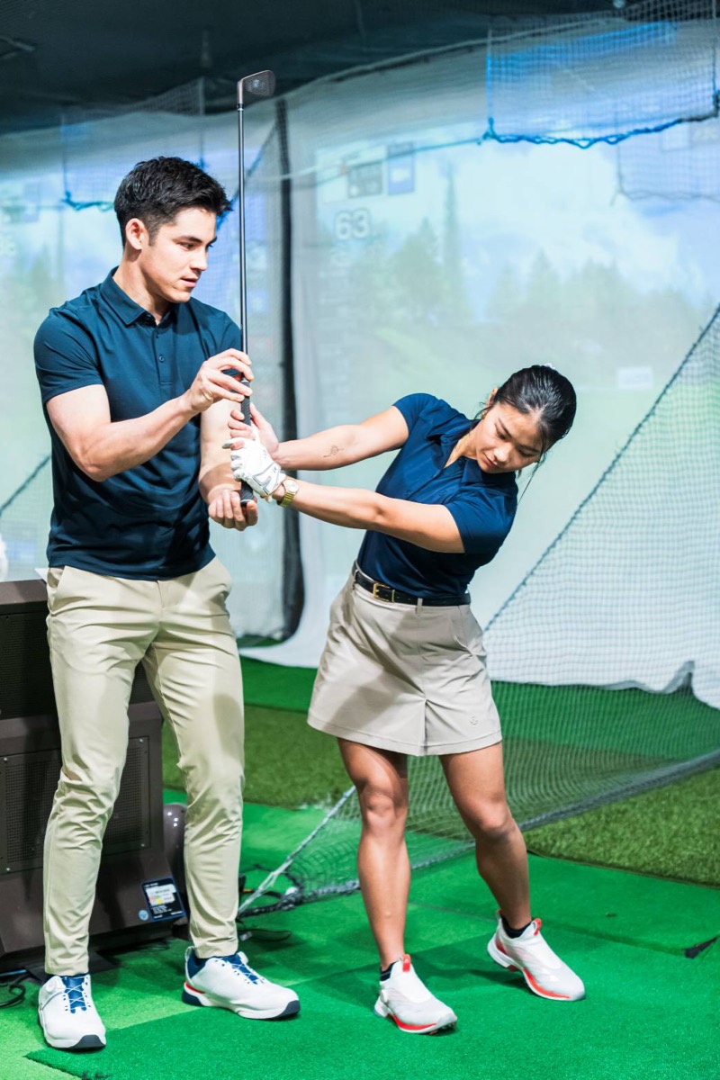 Louis analysing a student's swing on video